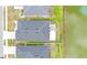 Aerial shot of a home with a concrete patio with outdoor seating near a pond at 8043 Brookeshire Dr, Lakeland, FL 33809