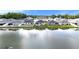 A scenic aerial view shows homes backing onto a lake, reflecting the serene beauty of the neighborhood at 8043 Brookeshire Dr, Lakeland, FL 33809