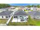 This aerial view showcases an inviting patio with cozy seating, set in a well-maintained backyard at 8043 Brookeshire Dr, Lakeland, FL 33809