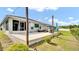 View of the backyard and patio area with outdoor seating and string lights at 8043 Brookeshire Dr, Lakeland, FL 33809