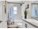 Bright bathroom featuring a shower over the tub and vanity with granite countertop at 8043 Brookeshire Dr, Lakeland, FL 33809