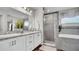 Bright bathroom features a double sink vanity, granite countertops, and glass shower doors at 8043 Brookeshire Dr, Lakeland, FL 33809
