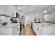 A bright kitchen features marble countertops, stainless steel appliances, and lots of storage in white cabinetry at 8043 Brookeshire Dr, Lakeland, FL 33809