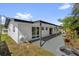 Spacious covered patio in backyard with outdoor seating area, perfect for relaxing and entertaining at 822 Oakview Dr, New Smyrna Beach, FL 32169