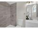 Updated bathroom featuring sleek vanity, shower, and tiled walls at 822 Oakview Dr, New Smyrna Beach, FL 32169