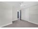 Neutral bedroom with a closet, providing storage space and an open doorway at 822 Oakview Dr, New Smyrna Beach, FL 32169