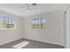 Sunlit bedroom features sleek wood floors and bright, open windows at 822 Oakview Dr, New Smyrna Beach, FL 32169