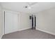 Bright bedroom with a ceiling fan and closet providing ample storage space at 822 Oakview Dr, New Smyrna Beach, FL 32169
