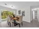 Dining room featuring modern decor, neutral paint, and large glass doors to the outdoors at 822 Oakview Dr, New Smyrna Beach, FL 32169