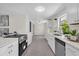 Clean and modern kitchen with stainless steel appliances and white countertops at 822 Oakview Dr, New Smyrna Beach, FL 32169