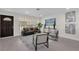 Bright living room with large windows, modern furnishings, and stylish decor for comfortable living at 822 Oakview Dr, New Smyrna Beach, FL 32169