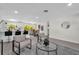 Open-concept living space with modern furniture, eat-in kitchen, and adjacent dining area at 822 Oakview Dr, New Smyrna Beach, FL 32169