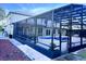 Spacious screened-in backyard with a custom pool, lounging area, and ample room for outdoor activities at 871 Blairmont Ln, Lake Mary, FL 32746