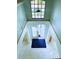 Bright foyer features soaring ceilings, marble floors, a skylight and a decorative chandelier at 871 Blairmont Ln, Lake Mary, FL 32746
