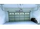 Spacious garage with a well-maintained door, offering ample storage and parking space at 871 Blairmont Ln, Lake Mary, FL 32746