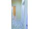 Neutral hallway with marble flooring, white doors, and soft, natural lighting for a clean, inviting feel at 871 Blairmont Ln, Lake Mary, FL 32746