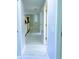 Hallway with clean, neutral colors and light wood floors, connecting the upper level of the home at 871 Blairmont Ln, Lake Mary, FL 32746