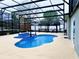 Relaxing backyard oasis featuring a custom pool with a charming waterfall and a screened-in enclosure at 871 Blairmont Ln, Lake Mary, FL 32746