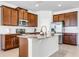 Spacious kitchen featuring a center island and stainless steel appliances at 970 Glazebrook Loop, Orange City, FL 32763