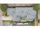 Aerial view showing the layout of the home, featuring a pool and backyard with a jacuzzi at 7404 Oconee St, Reunion, FL 34747