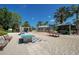 Beach area featuring sand, palm trees, picnic tables, game tables, a bar, and covered seating at 7404 Oconee St, Reunion, FL 34747