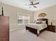 Bedroom with natural light, carpet floors, and comfortable furnishings at 7404 Oconee St, Reunion, FL 34747