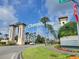 The impressive entrance to Champions Gate with signage and palm trees at 7404 Oconee St, Reunion, FL 34747