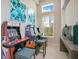 Game room with classic arcade games, stools, modern decor, and plenty of natural light with outdoor view at 7404 Oconee St, Reunion, FL 34747