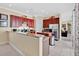 Well-equipped kitchen with stainless steel appliances, granite countertops, and ample cabinet space at 7404 Oconee St, Reunion, FL 34747