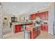 Bright kitchen featuring granite countertops, stainless appliances, and an open design at 7404 Oconee St, Reunion, FL 34747