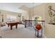 Spacious loft with pool table, carpet, and plenty of natural light at 7404 Oconee St, Reunion, FL 34747