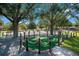 Enchanting mini golf course shaded by mature trees, offering a fun and relaxing recreation area at 7404 Oconee St, Reunion, FL 34747