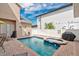 The backyard features a private pool and spa, surrounded by a brick patio and white fences at 7404 Oconee St, Reunion, FL 34747