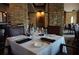 Elegant restaurant dining area with brick columns and tables set with glasses and silverware at 7404 Oconee St, Reunion, FL 34747
