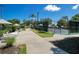 Tennis courts with lush landscaping offering a peaceful and active community at 7404 Oconee St, Reunion, FL 34747