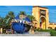 The Universal Globe in front of Universal Studios archway with palm trees at 7404 Oconee St, Reunion, FL 34747