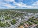 High-angle shot captures a charming neighborhood dotted with houses, trees, and a clear sky above at 2829 Aloma Ave, Winter Park, FL 32792