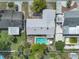 Aerial view showcasing a private backyard pool surrounded by patio seating and greenery at 2829 Aloma Ave, Winter Park, FL 32792
