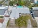 Overhead view features a home with a backyard pool, adjacent patio furniture, and surrounding foliage at 2829 Aloma Ave, Winter Park, FL 32792