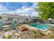 Backyard pool with patio furniture, outdoor lighting, and a fire pit, great for relaxation and entertainment at 2829 Aloma Ave, Winter Park, FL 32792
