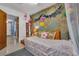 Bright bedroom decorated with a world map wall at 2829 Aloma Ave, Winter Park, FL 32792