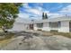 Charming single-story home featuring a garage and a driveway for additional parking at 2829 Aloma Ave, Winter Park, FL 32792