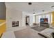 Bright living room with a fireplace, and a large window, and a television set up at 2829 Aloma Ave, Winter Park, FL 32792
