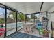 Screened patio area featuring a table with chairs, and access to the pool area at 2829 Aloma Ave, Winter Park, FL 32792