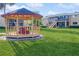 Inviting gazebo provides a tranquil spot within the community's green space at 1000 Lake Of The Woods Blvd # 103H, Casselberry, FL 32730