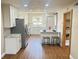 Bright kitchen features white cabinets, stainless steel appliances, and a breakfast bar with seating at 1000 Lake Of The Woods Blvd # 103H, Casselberry, FL 32730
