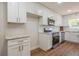 Bright kitchen featuring granite countertops, updated appliances, and plenty of cabinet space for storage at 1000 Lake Of The Woods Blvd # 103H, Casselberry, FL 32730