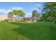 Expansive lawn area with a gazebo, mature trees, and well-maintained landscaping create a serene outdoor space at 1000 Lake Of The Woods Blvd # 103H, Casselberry, FL 32730