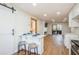 Bright living area featuring breakfast bar, fireplace, and sliding glass doors to a patio at 1000 Lake Of The Woods Blvd # 103H, Casselberry, FL 32730