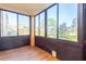 Enclosed patio offers views of well-maintained grounds and community buildings at 1000 Lake Of The Woods Blvd # 103H, Casselberry, FL 32730
